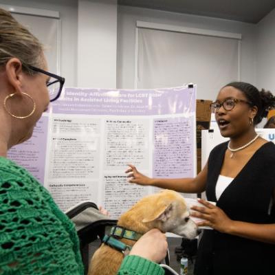 Student presenting at undergraduate research symposium